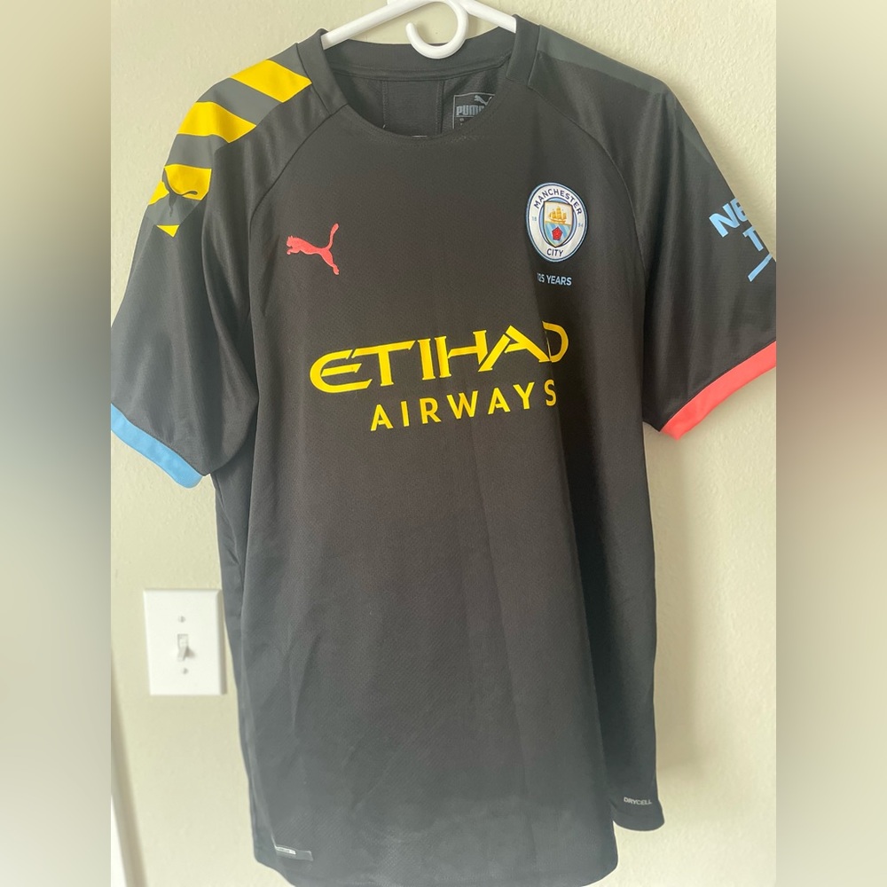 Puma Manchester City Black Jersey with Yellow and Red Accents